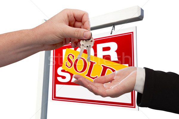 Agent Handing Over the Key to a New Home Stock photo © feverpitch