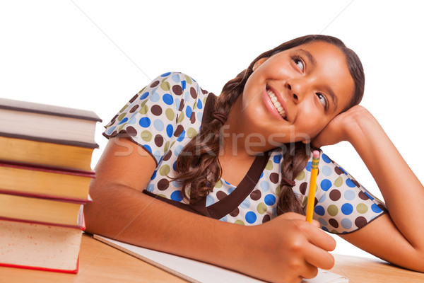 Pretty Hispanic Girl Daydreaming While Studying on White Stock photo © feverpitch