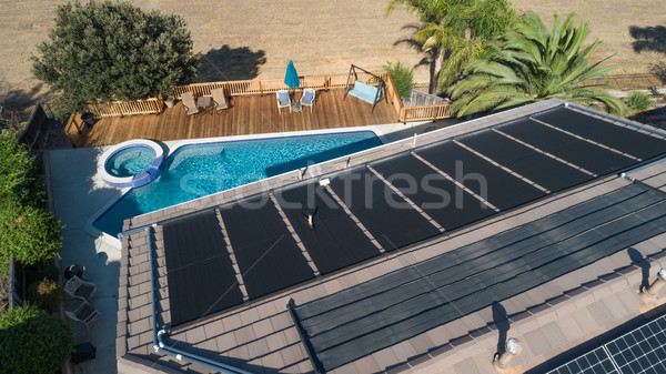 Thermal Solar Panels Installed on the Roof of a Large House Stock photo © feverpitch