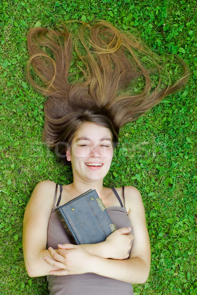 Biblia lány pihen zöld fű tart klasszikus Stock fotó © filmstroem