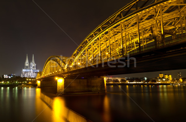 Cologne Cathedral and Hohenzollern Bridge at night, Cologne, Germany Stock photo © fisfra