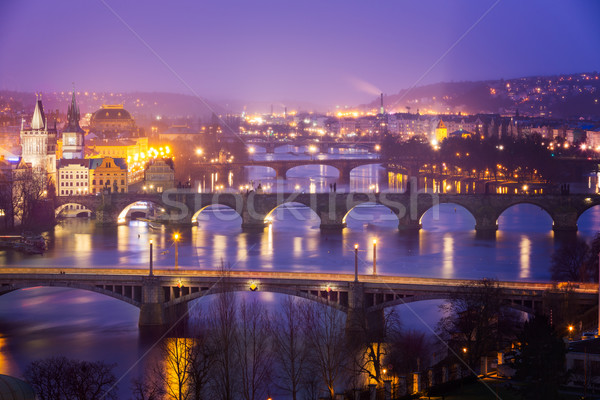 Vltava (Moldau) River at Prague with Charles Bridge at dusk, Cze Stock photo © fisfra