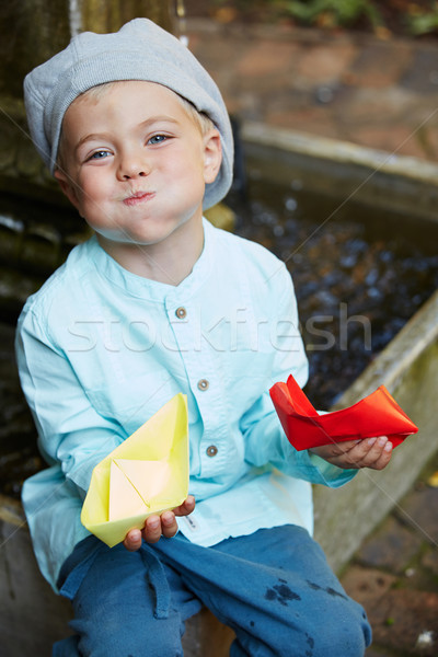 Carta origami barca piccolo quattro anni ragazzo Foto d'archivio © forgiss