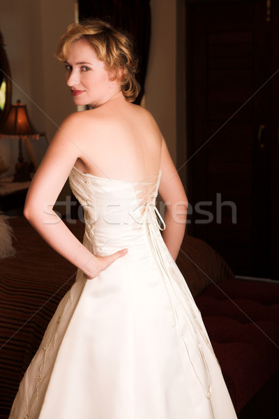 Jungen Braut tragen Hochzeitskleid Champagner Stock foto © Forgiss