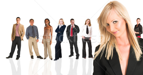 Femeie de afaceri în picioare oameni de afaceri frumos grup Imagine de stoc © Forgiss