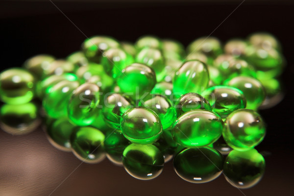 Green medical capsules Stock photo © Forgiss