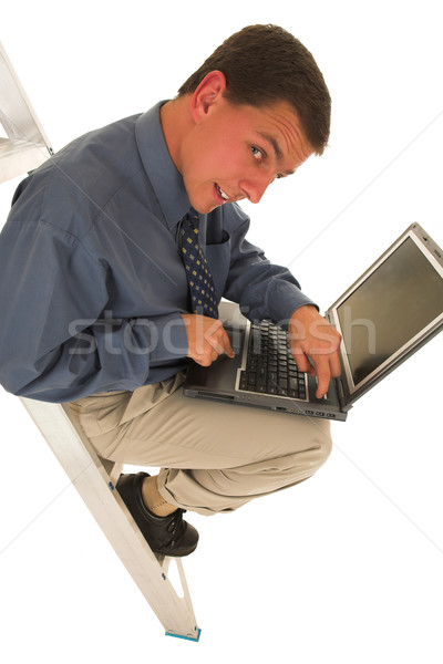 Geschäftsmann schauen schuldig Computer Lächeln Laptop Stock foto © Forgiss