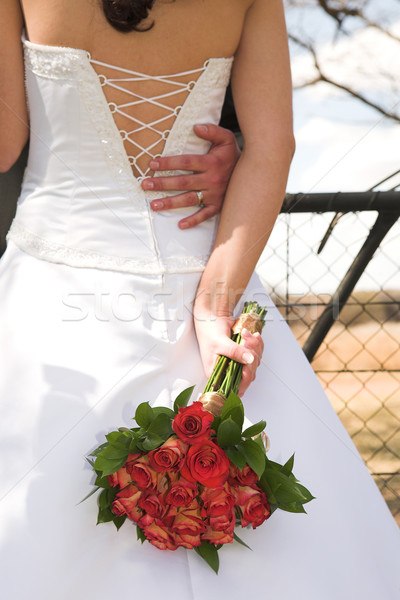 [[stock_photo]]: Mariée · jeunes · blanche · robe · de · mariée · luxueux · roses · rouges