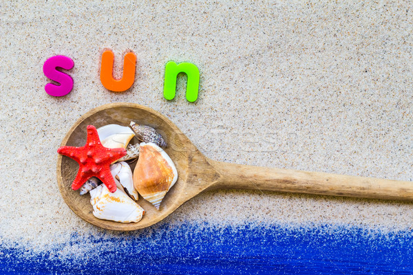 Stock photo: Word sun laid sand blue board