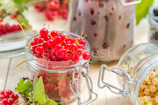 Stock photo: Preparation products processed fresh colorful summer fruits jars