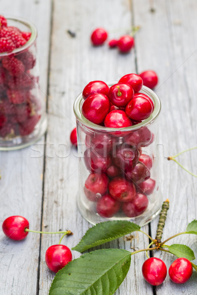 Fruits cherries raspberries wooden table Stock photo © fotoaloja