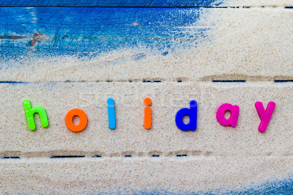 word holiday laid sand blue board Stock photo © fotoaloja