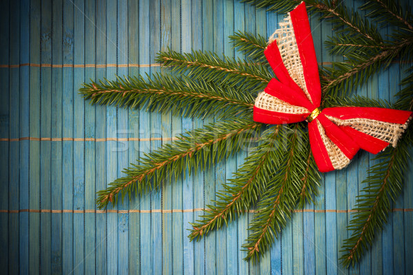 Christmas card with bow on spruce twig Stock photo © fotoaloja