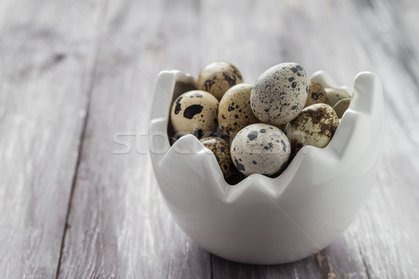 Small quail eggs wooden table dish Stock photo © fotoaloja