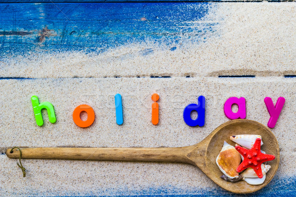 word holiday laid sand blue board Stock photo © fotoaloja