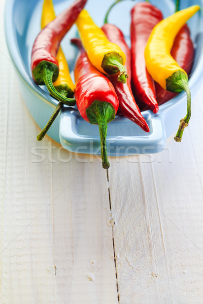 Farbenreich Paprika blau Schüssel Feuer Holz Stock foto © fotoaloja
