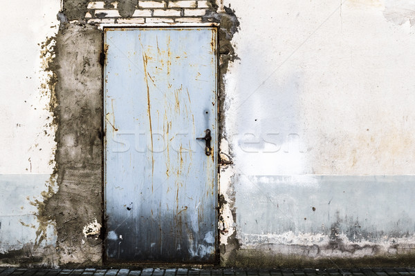 Ruined brick wall closed steel door Stock photo © fotoaloja