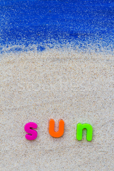Word sun laid sand blue board Stock photo © fotoaloja