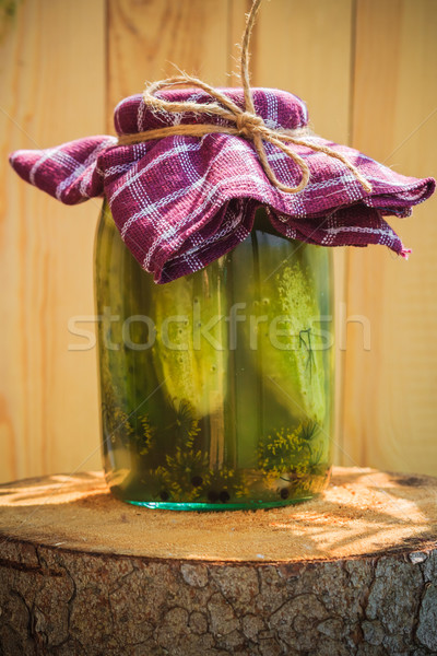Jar pickled cucumbers wooden stump Stock photo © fotoaloja