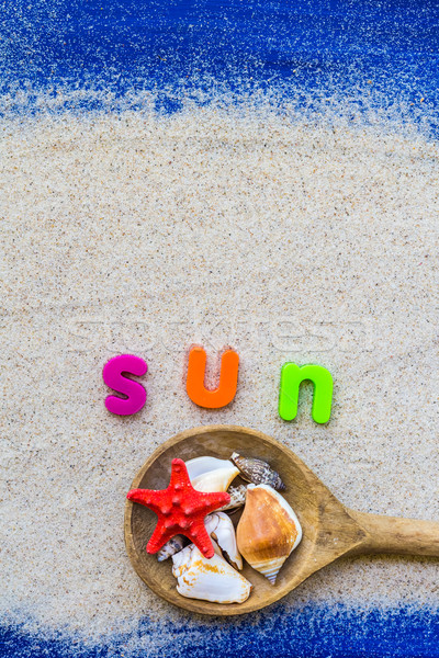 Word sun laid sand blue board Stock photo © fotoaloja