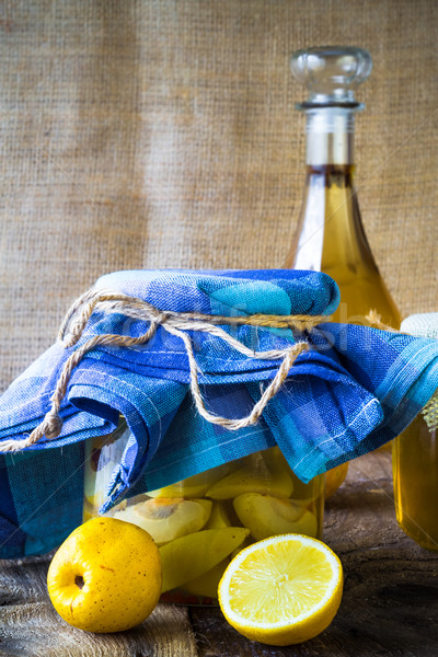 alcohol jar quince liqueur sliced fruit prepare wooden setting Stock photo © fotoaloja