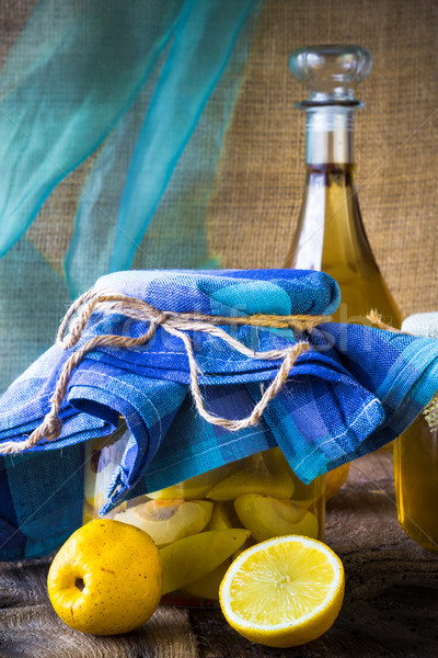 alcohol jar quince liqueur sliced fruit prepare wooden setting Stock photo © fotoaloja