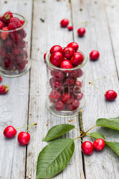 Stock photo: Glasses full freshly picked cherries raspberries