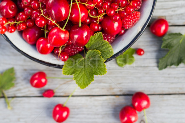 Stock photo: Steel bowl filled variety fruit