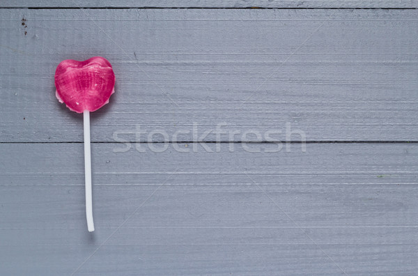 Rózsaszín szív alakú nyalóka szürke fa Stock fotó © fotoaloja