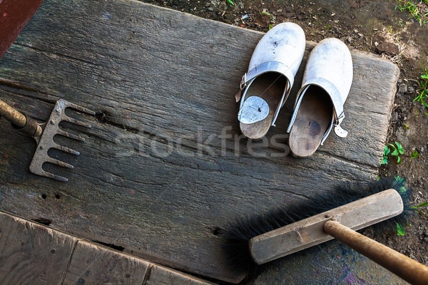 Clogs shoes boots broom string rake wooden porch schoes Stock photo © fotoaloja