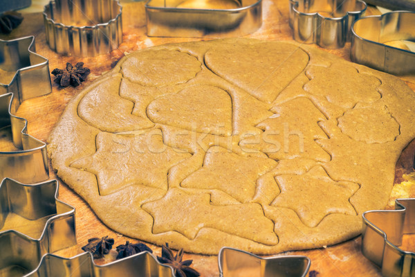 Stock photo: Christmas glazed biscuit shapes imprinted dough Kitchen table wi