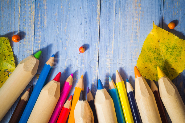 Vintage background colored pencils autumn fruits blue table Stock photo © fotoaloja