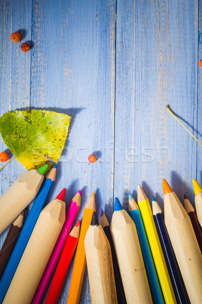 Vintage background colored pencils autumn fruits blue table Stock photo © fotoaloja