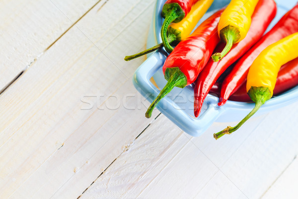 Farbenreich Paprika blau Schüssel Feuer Holz Stock foto © fotoaloja