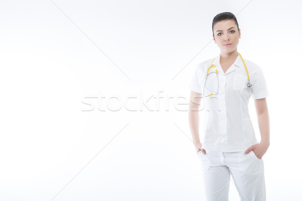Positive medical doctor woman with stethoscope. Isolated white b Stock photo © fotoduki