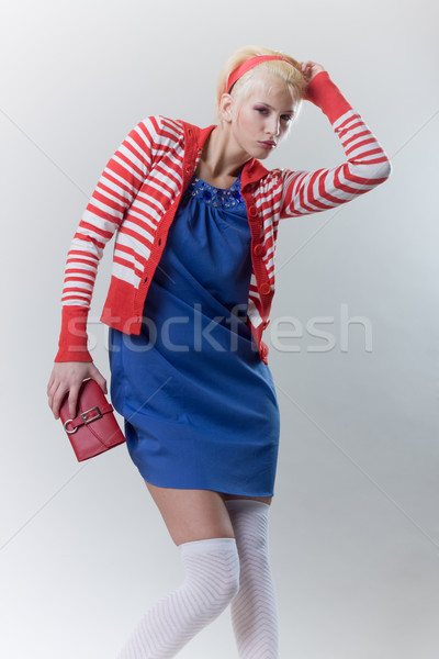 emotion pose blond girl in red woolly Stock photo © fotoduki