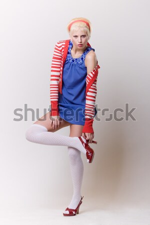 emotion pose blond girl in red woolly Stock photo © fotoduki