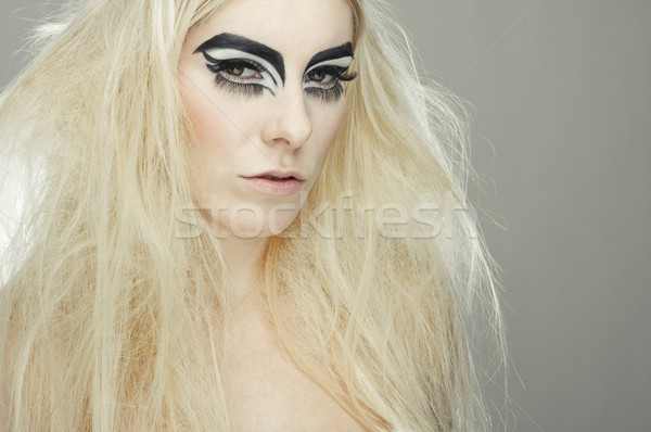 beautiful blond girl with cat eyes make-up Stock photo © fotoduki