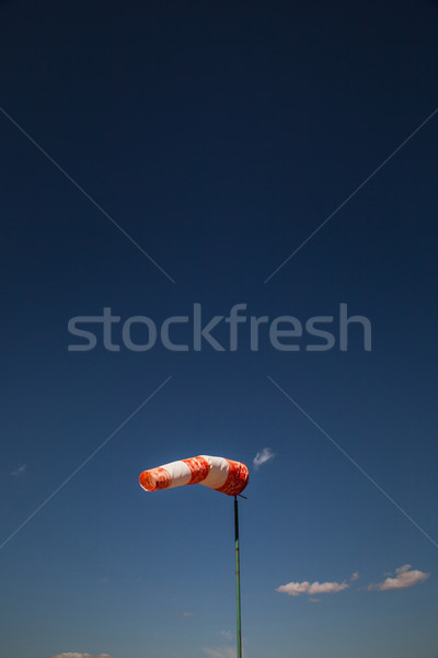 Stock photo: wind old sock against a blue sky