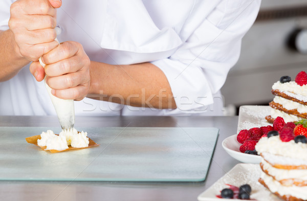 Pastry chef decorating Stock photo © fotoedu