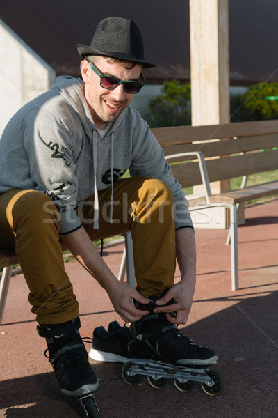 Man tying skates Stock photo © fotoedu