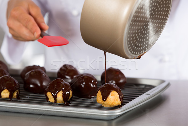 Chef decorating some profiteroles Stock photo © fotoedu