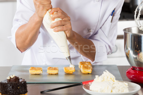 Chef with a pastry bag Stock photo © fotoedu