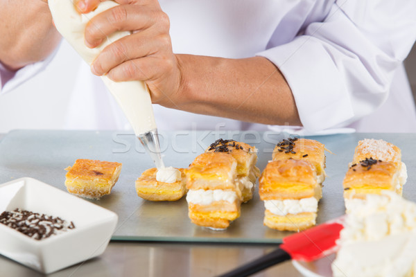 Chef with a pastry bag Stock photo © fotoedu