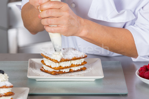 Pastry chef decorating Stock photo © fotoedu