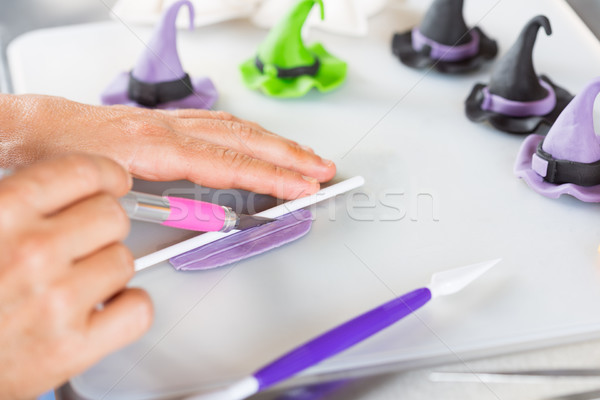 Stock photo: Confectioner with figures of halloween