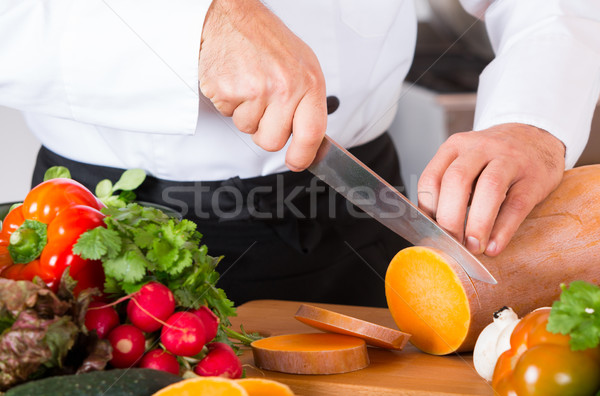 Chef chopping vegetables Stock photo © fotoedu