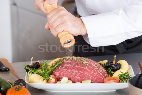 Chef preparing a dish Stock photo © fotoedu