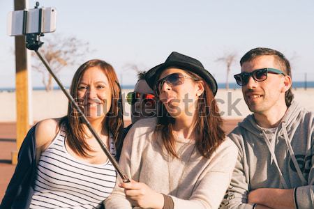 Stock photo: Young people making a selfie