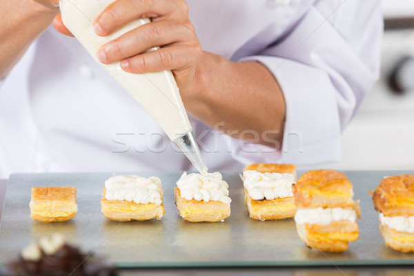 Chef with a pastry bag Stock photo © fotoedu